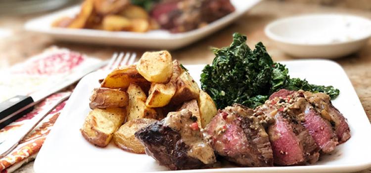 Crushed Peppercorn Steak with Creamed Kale and Potato Wedges